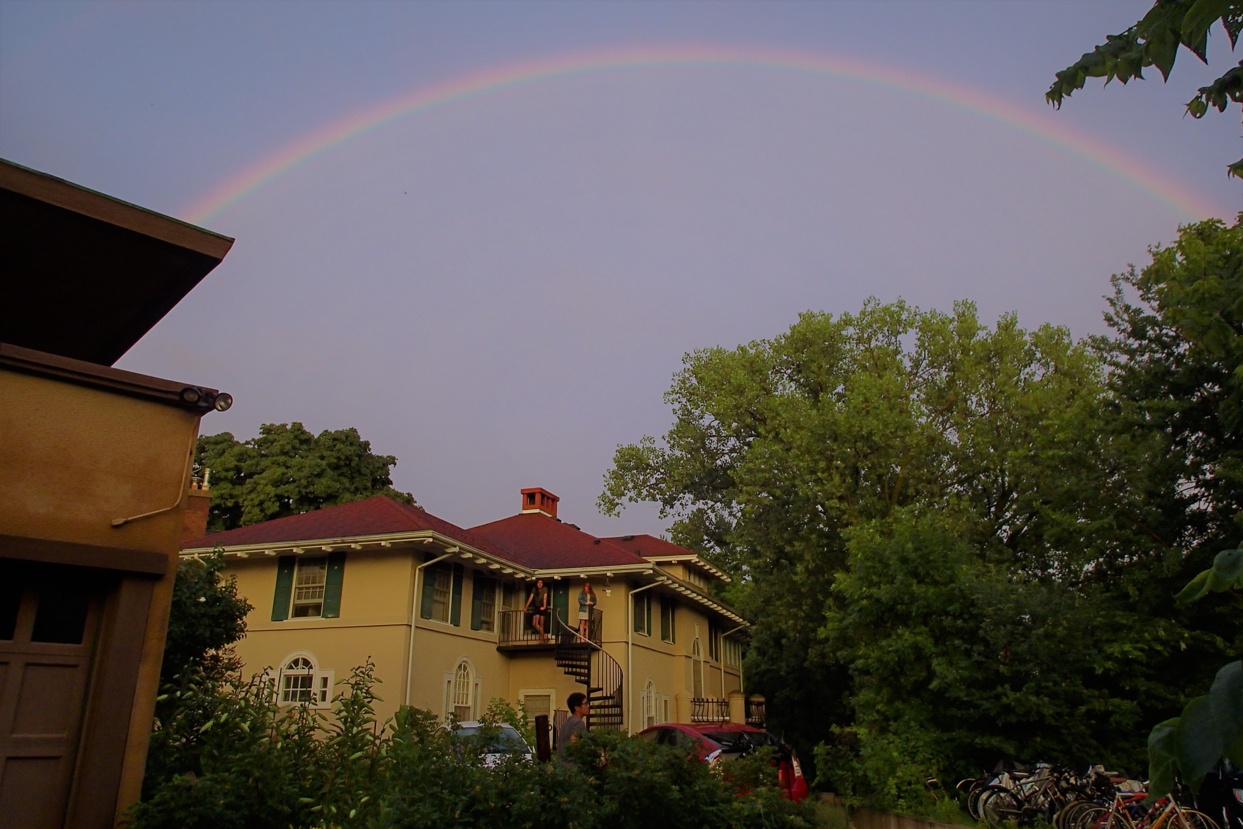 A full rainbow arches over Summit